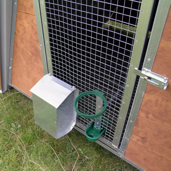 Feeder and drinker of small chicken coop with raised floor