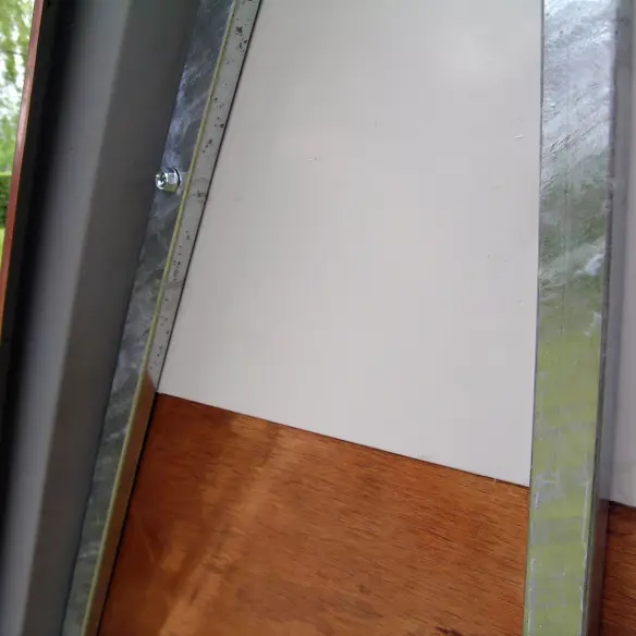 Back of galvanized steel ground chicken coop