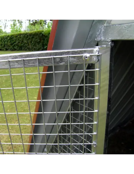 Door of ground chicken coop with locking latch and padlock fitting