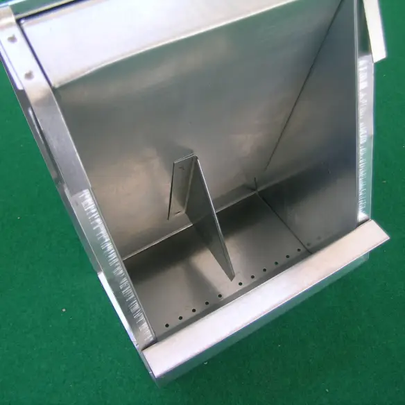 Cleaning holes to remove feed impurities