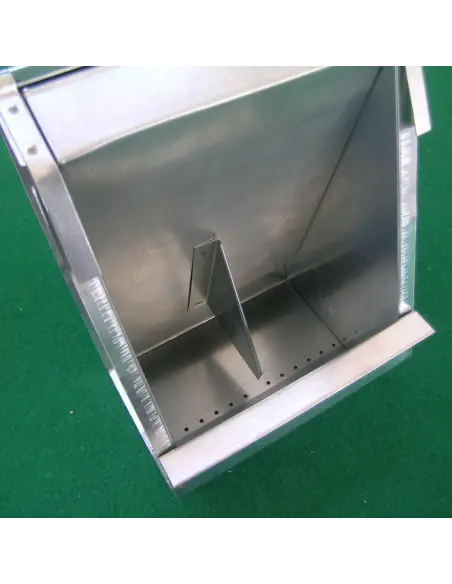 Cleaning holes to remove feed impurities