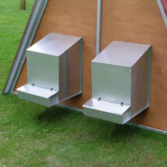 Nesting box mounted on outdoor chicken coop