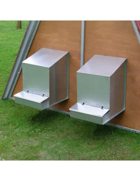 Nesting box mounted on outdoor chicken coop Nesting box mounted on outdoor chicken coop