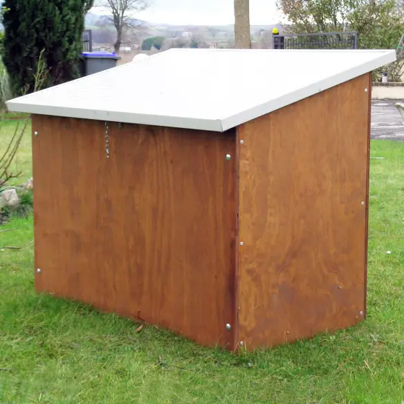 Back view of wooden dog house