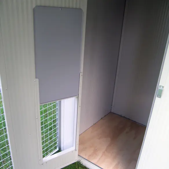 Entrance with raised wooden platform in sleeping area